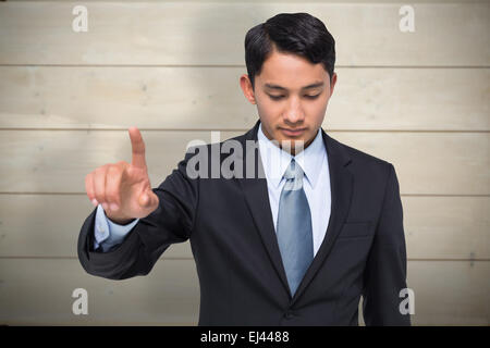 Image composite de stern asian businessman Banque D'Images