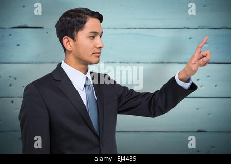 Image composite de stern asian businessman Banque D'Images