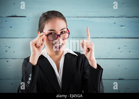 Image composite de young businesswoman getting une idée Banque D'Images