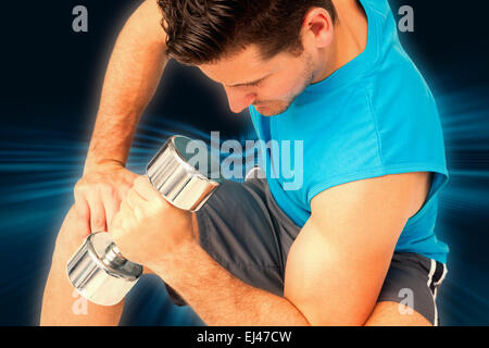Image composite de close-up of a fit man exercising with dumbbell Banque D'Images