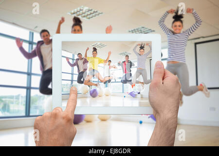 Image composite de hand holding tablet pc Banque D'Images