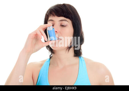 Close up image of a young woman using inhaler Banque D'Images