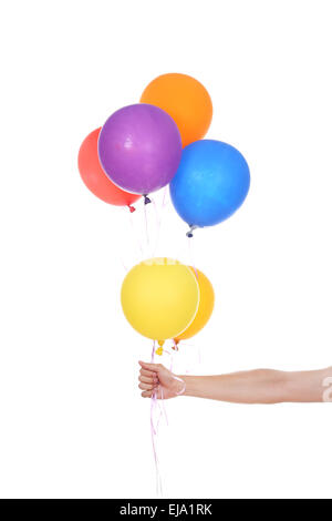 La main avec des ballons colorés isolé sur fond blanc Banque D'Images