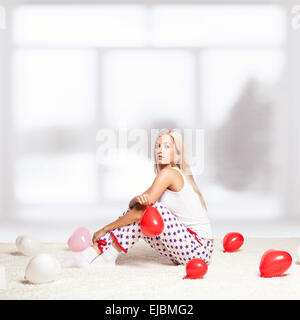 Femme blonde avec des ballons Banque D'Images