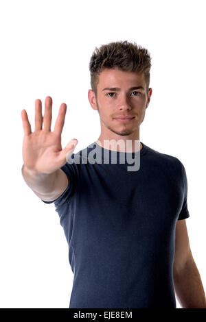 Beau jeune homme seerious faisant arrêter signe avec sa main, isolated on white Banque D'Images