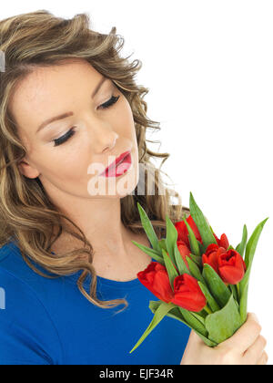 Attractive Woman holding a bunch of tulips Banque D'Images