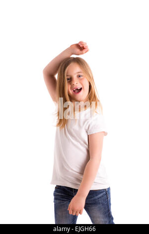 Kid girl blonde haut vent saut en retrait sur des cheveux denim jeans à fond blanc Banque D'Images