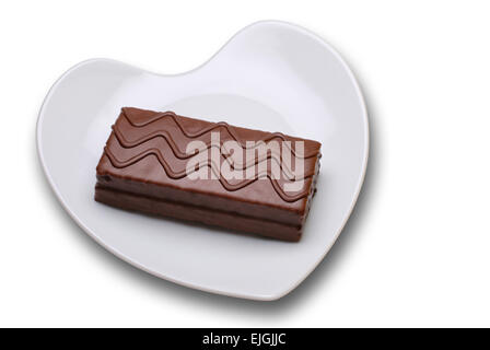 Snack-chocolat sur le plat en forme de coeur Banque D'Images