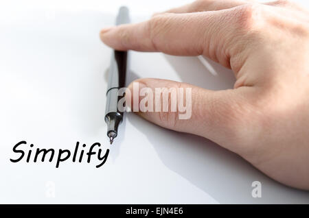 La main de l'écrit simplifier isolated over white background - concept d'affaires Banque D'Images