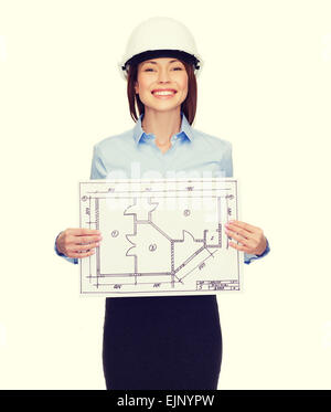 Smiling businesswoman in casque montrant plan Banque D'Images