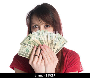 Femme couvrant la moitié face avec 20 US Dollar Bills Banque D'Images