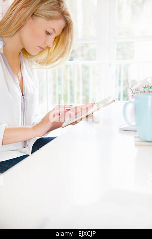 Young Woman Using Tablet Computer