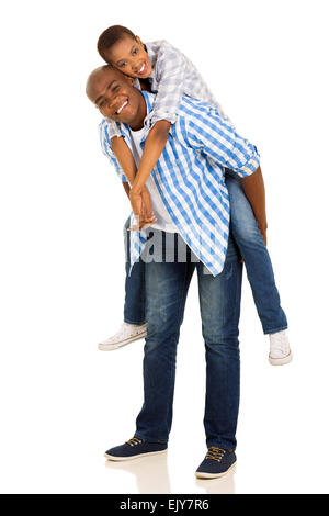 African American couple ludique piggyback sur fond blanc Banque D'Images