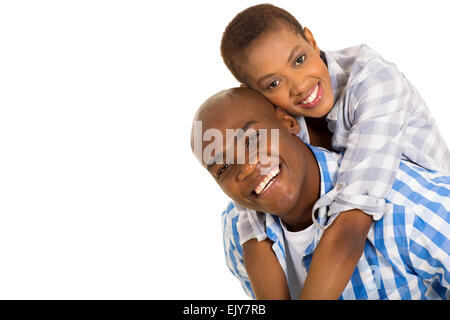 Cheerful young black couple piggybacking on white Banque D'Images