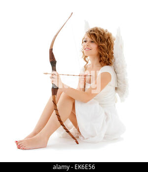 Teenage girl cupidl avec arc et flèche Banque D'Images