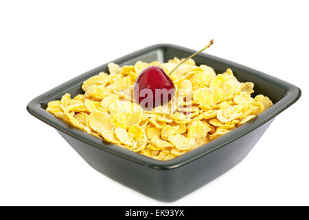 Bol de cornflakes et cerises isolated on white Banque D'Images