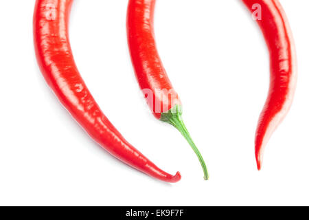 Juicy red chili peppers isolated on white Banque D'Images