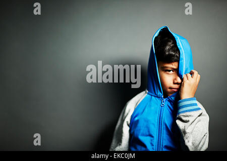 Boy wearing hooded top Banque D'Images