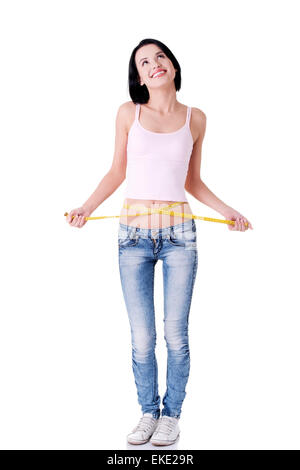 Young woman measuring her waist Banque D'Images