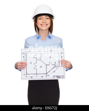 Smiling businesswoman in casque montrant plan Banque D'Images