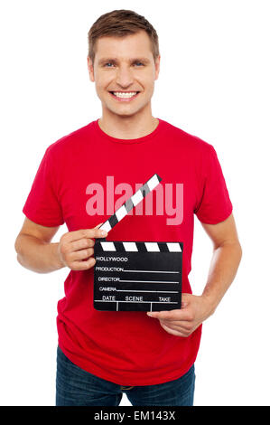 Smiling young guy holding cocoon Banque D'Images