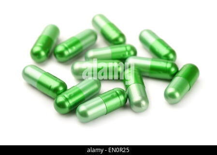 Green pills isolated on white Banque D'Images