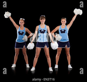 Studio shot of cheerleaders (16-17) dancing Banque D'Images