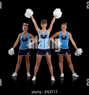 Studio shot of cheerleaders (16-17) dancing Banque D'Images