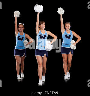 Studio shot of cheerleaders (16-17) dancing Banque D'Images