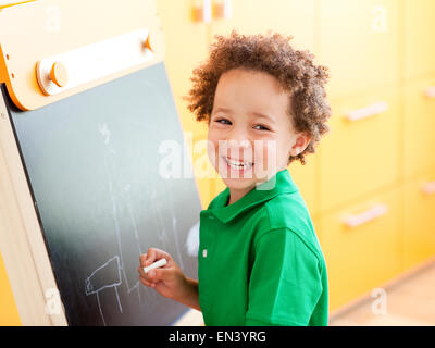 Orem, young woman holding chalk Banque D'Images