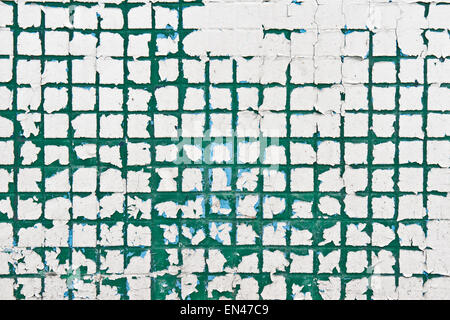 L'écaillage de la peinture sur un mur de tuiles comme une image d'arrière-plan Banque D'Images