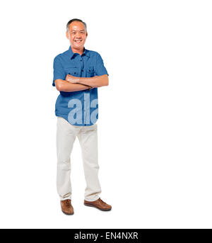 Confiant Mature Man Standing with Arms Crossed Banque D'Images