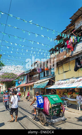 Tricycle des taxis dans la zone coloniale historique intramuros de Manille, Philippines Banque D'Images