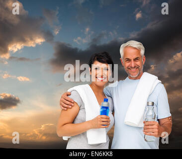 Composite image of happy fit couple Banque D'Images