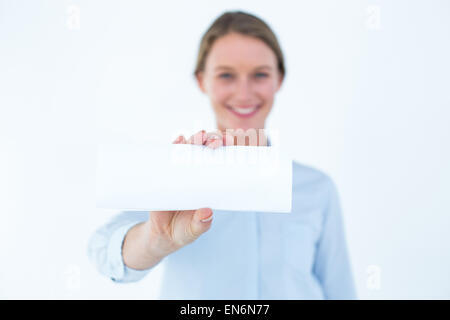 Businesswoman showing her business card Banque D'Images