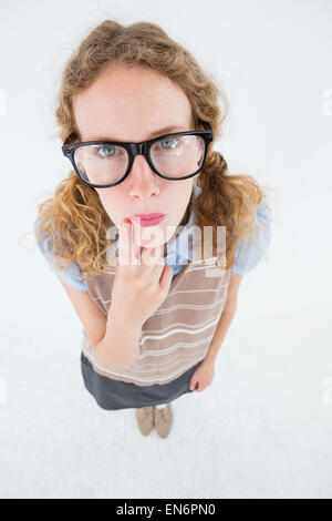 Hipster geek woman thinking with hand on chin Banque D'Images