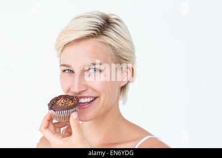 Attractive Woman eating muffin Banque D'Images