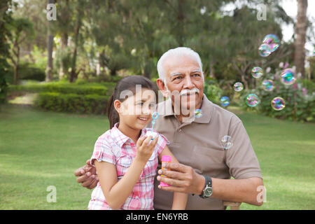 Young boy with digital tablet laughing Banque D'Images