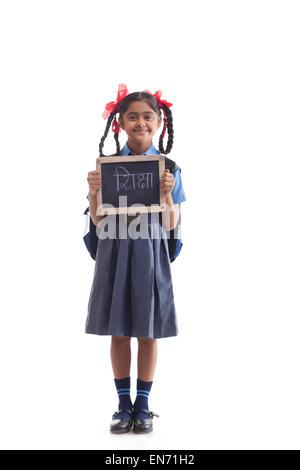 Portrait of school girl holding slate Banque D'Images