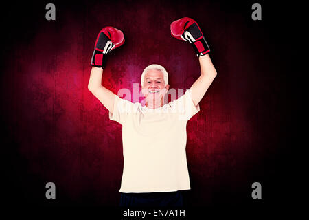 Image composite de senior man in boxing gloves Banque D'Images