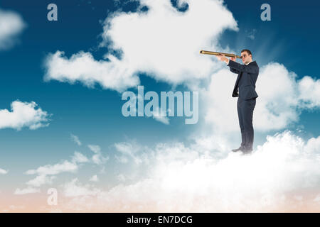 Image composite de businessman looking through telescope Banque D'Images