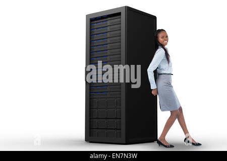 Composite image of young businesswoman poussant un panneau avec son dos Banque D'Images