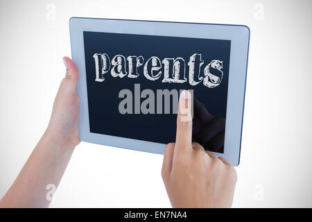 Les parents contre woman using tablet pc Banque D'Images