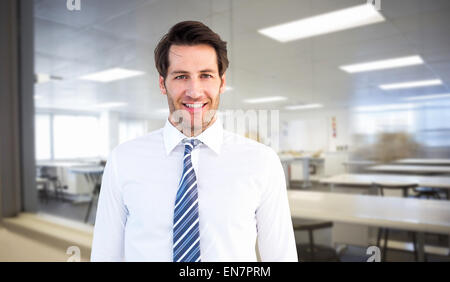 Portrait of businessman standing with hands in pockets Banque D'Images