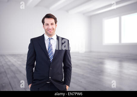 Portrait of businessman standing with hands in pockets Banque D'Images