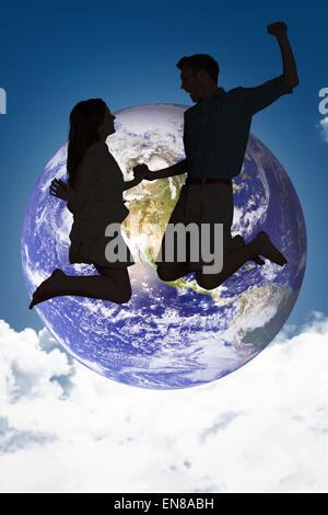 Image composite de cheerful young couple jumping Banque D'Images