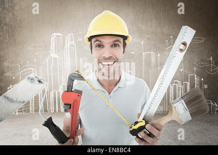 Image composite de portrait of happy worker holding divers équipements Banque D'Images