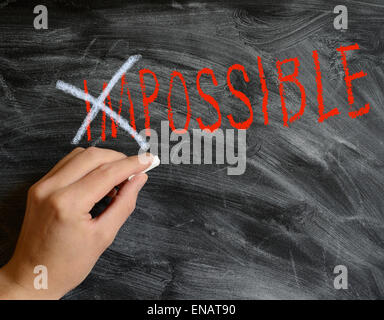 La main sur un tableau noir Possible Banque D'Images