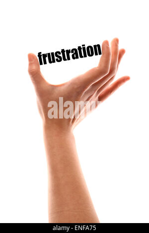 D'un coup horizontal de la couleur d'une main serrant le mot "frustration". Banque D'Images