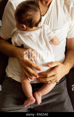 High angle view of father holding baby boy Banque D'Images